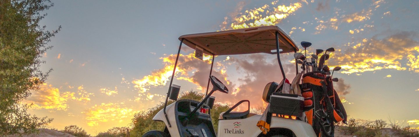 Golf buggy in the sand