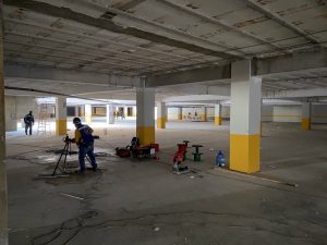 Conduit-being-cut-and-installed-underground.-scaled